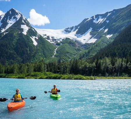 anchorage lake mountains kayakers kayaking blue sky anchorage city guide family days out