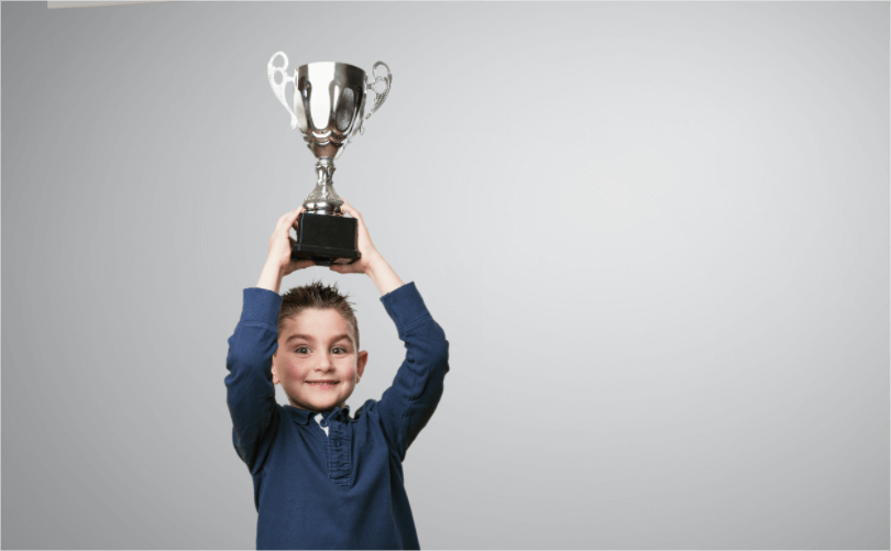 kid-with-trophy-his-head.png